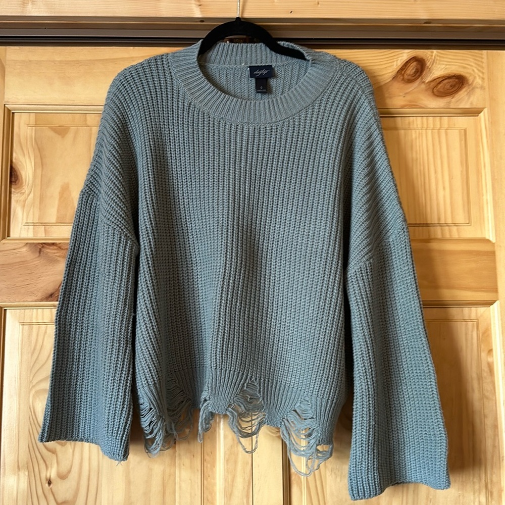 Distressed bell sleeve sweater